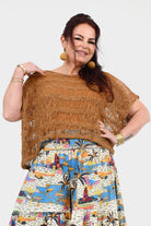 Caramel popcorn knit sleeveless top with textured yoke and fringe sides
