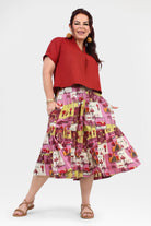 Pink multicolor tiered 3/4 pants with illustrated patchwork print