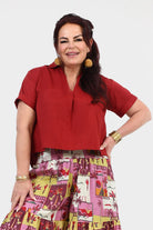 Dark red short-sleeve V-neck top with chest pocket and straight hem