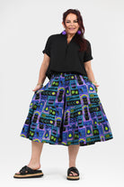 3/4 pants with black waistband and teal/purple novelty print, gathered tiers