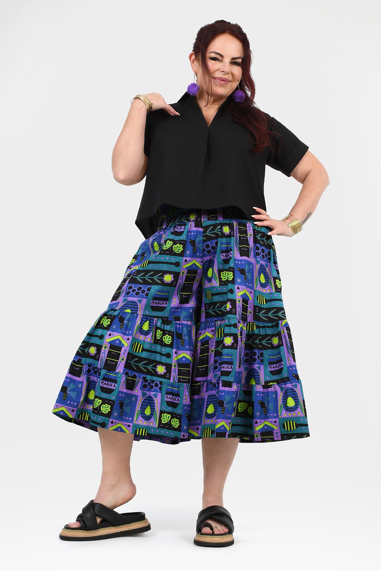 Havana 3/4 pants with black waist and teal/purple patterned fabric, tiered look