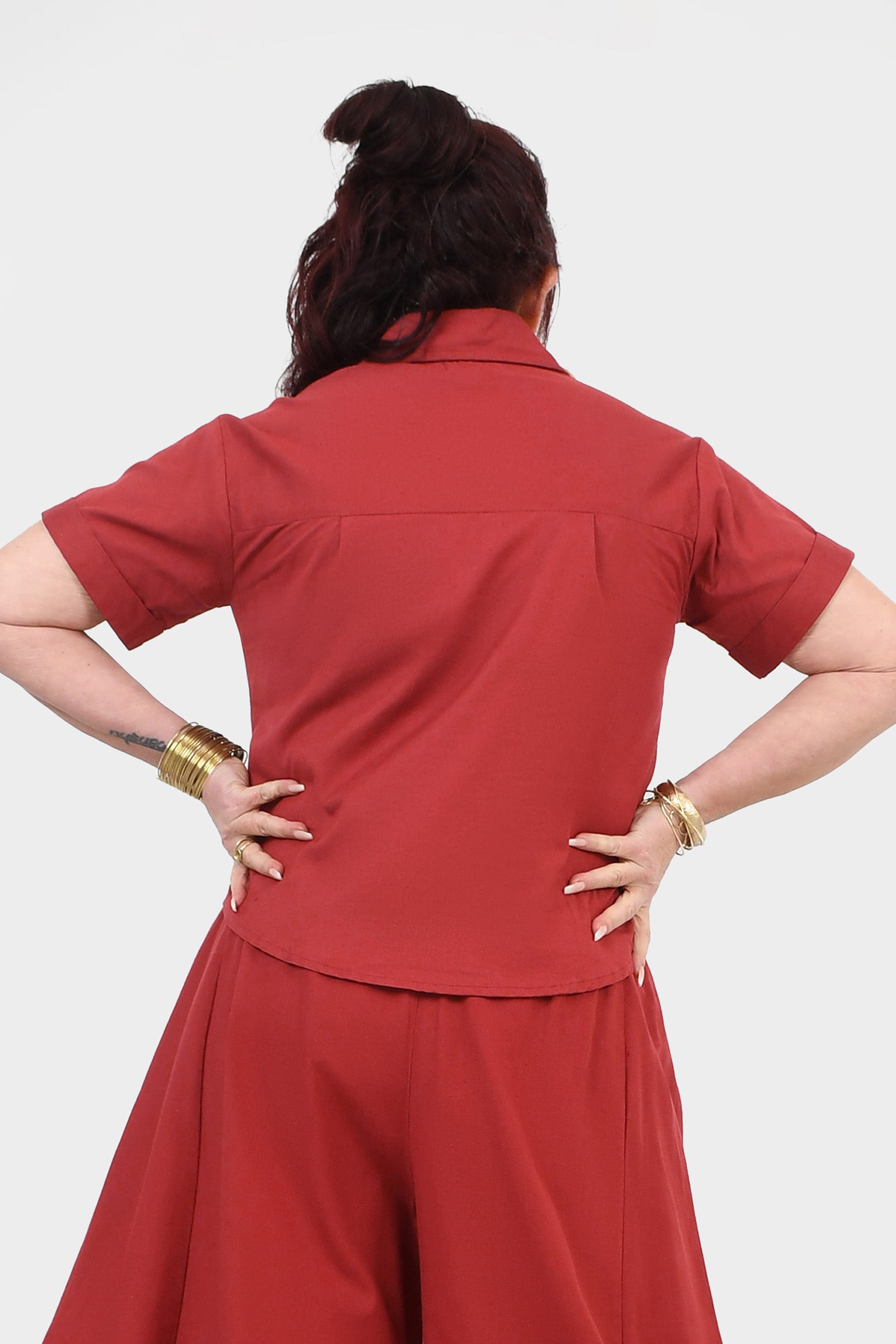 Dark red short-sleeve top, V-neck back view, relaxed fit with smooth yoke seam