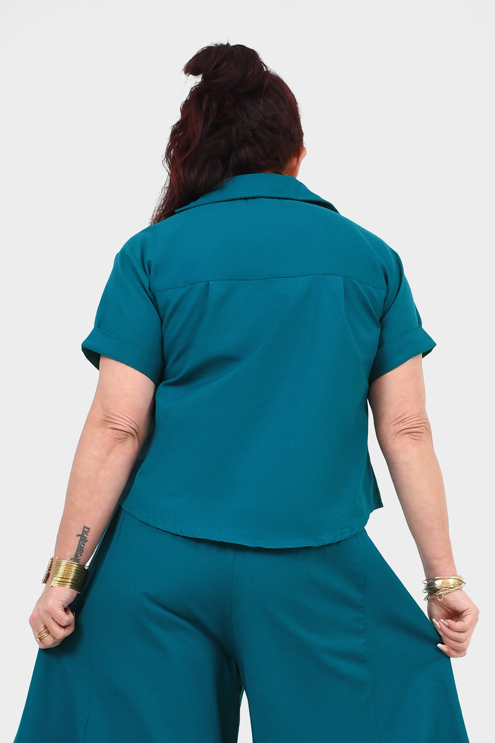 Dark teal back view V-neck short-sleeve top