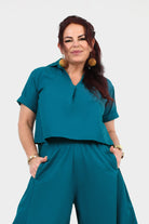 Dark teal V-neck short-sleeve top with chest pocket