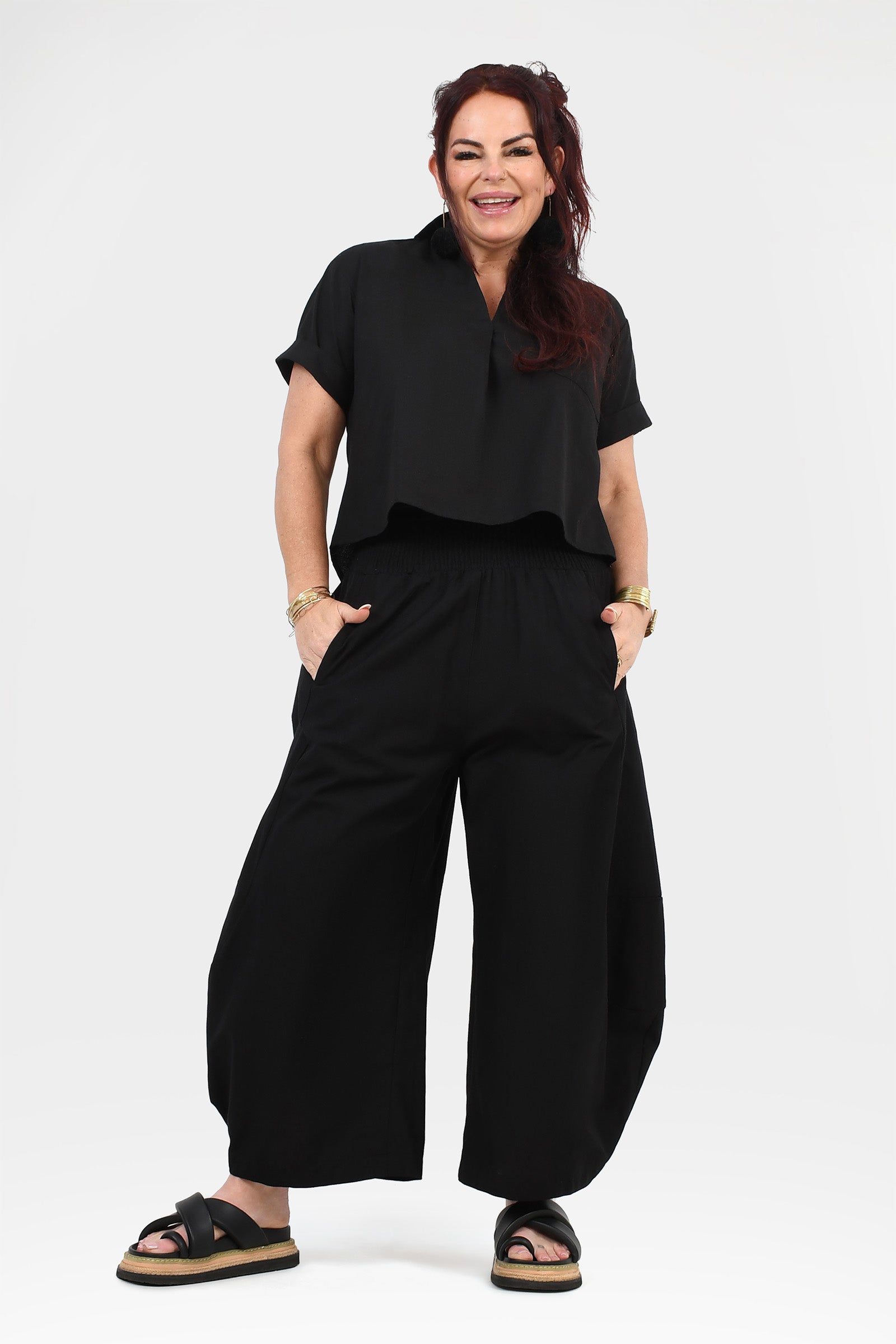 Black wide-leg pants with elastic waist and roomy, straight-to-wide silhouette