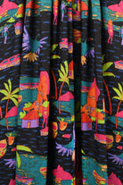 Black drawstring pants with vibrant tropical scene print all over