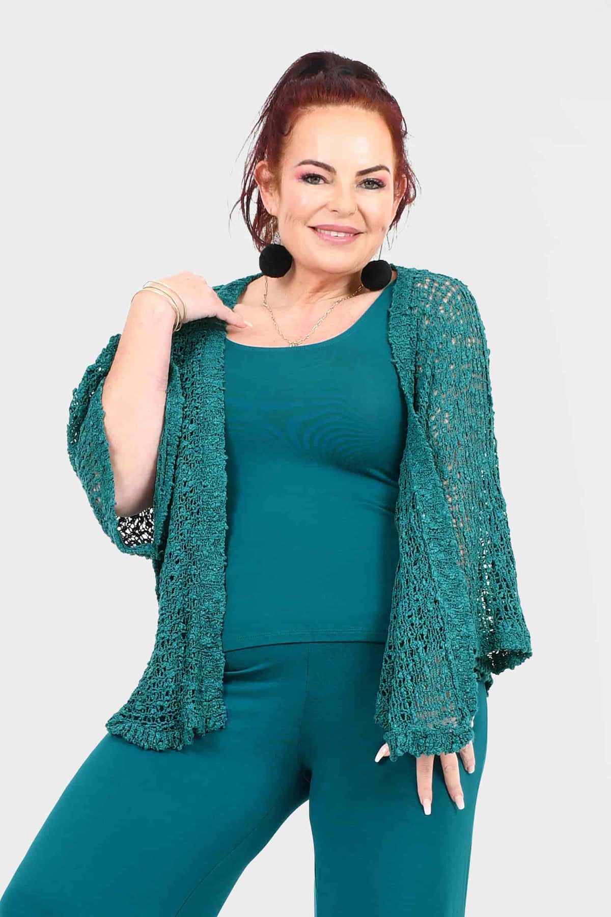 Teal open-front popcorn-knit jacket with textured body and flared 3/4 sleeves