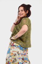 Olive popcorn-knit short-sleeve top with round neckline, relaxed drape