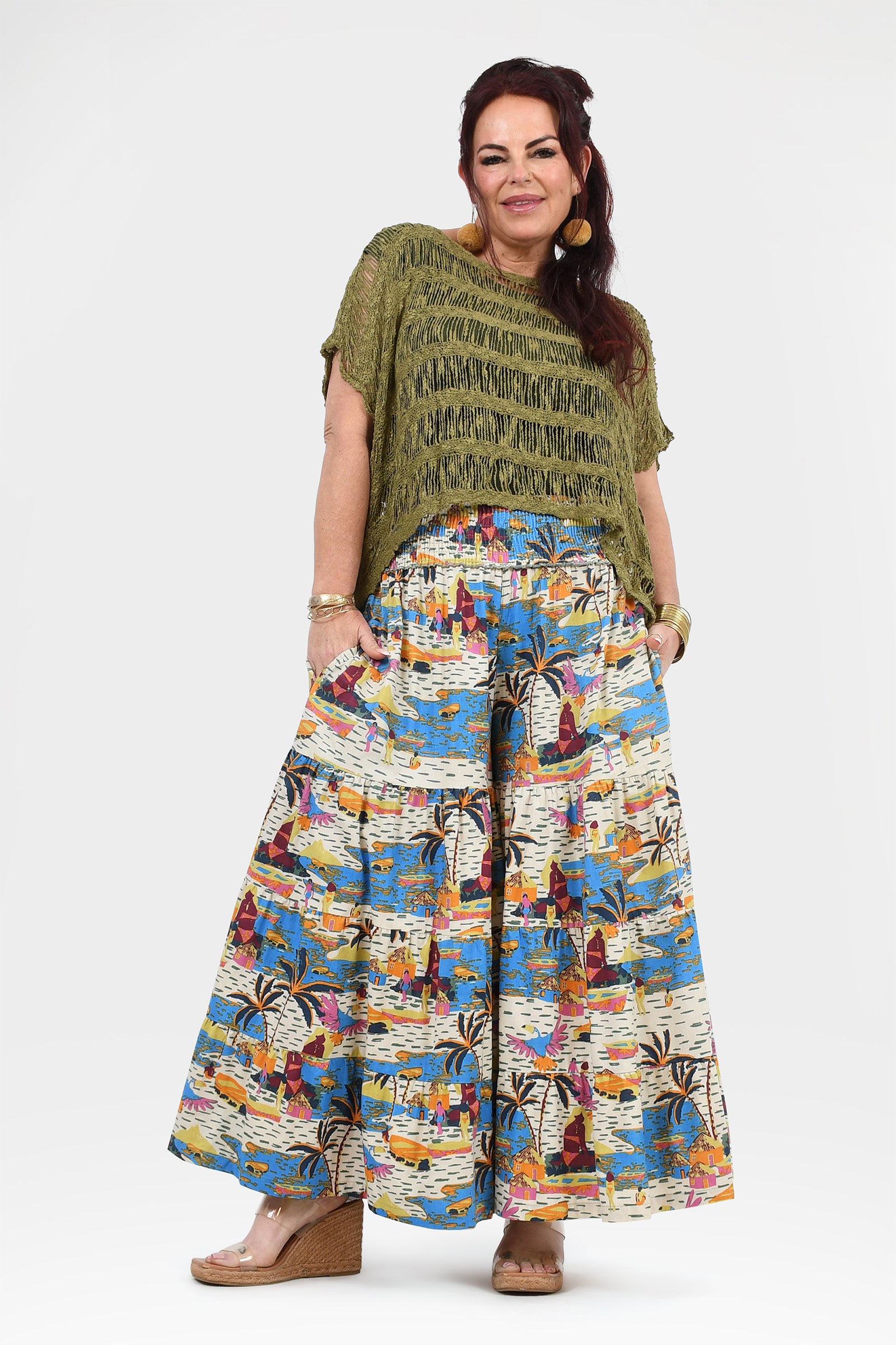 White and multicolor jungle print wide-leg pants with elastic waistband, wide flowing legs