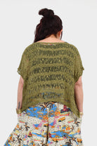 Olive popcorn-knit back top with short sleeves and round neckline, loose silhouette