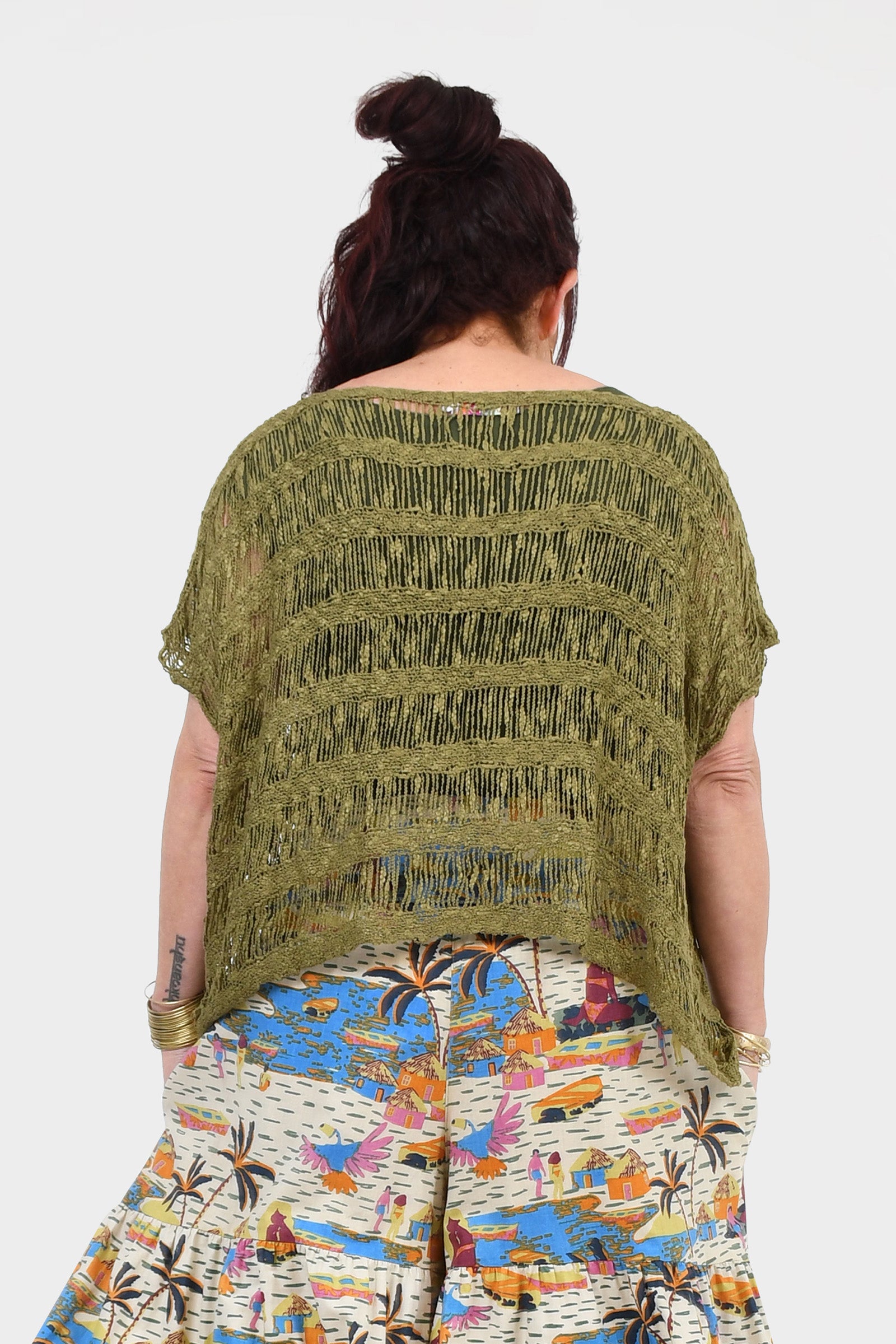 Olive popcorn-knit back top with short sleeves and round neckline, loose silhouette