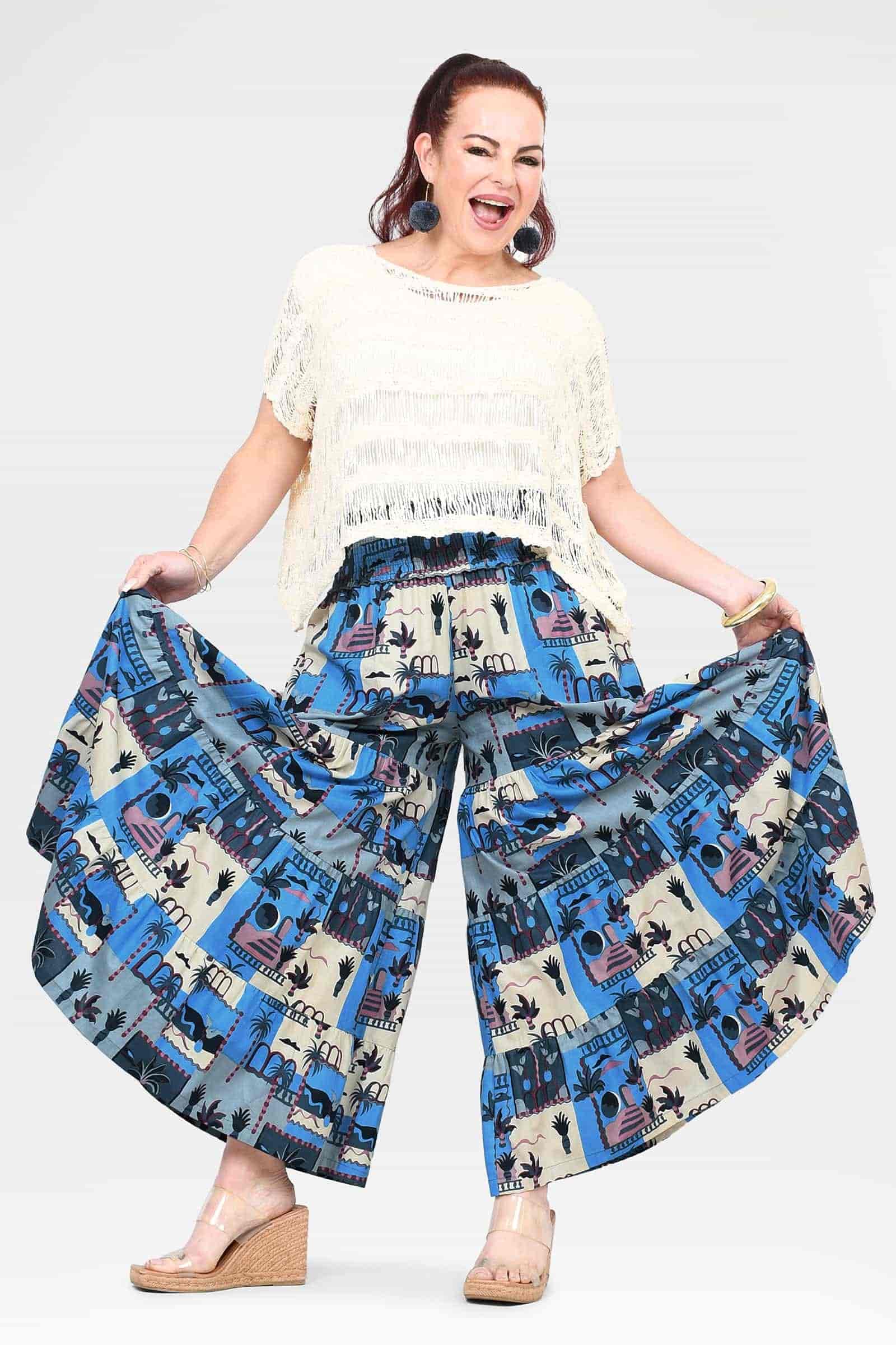 Blue and cream city-print wide-leg pants with elastic waist and flowing flared legs