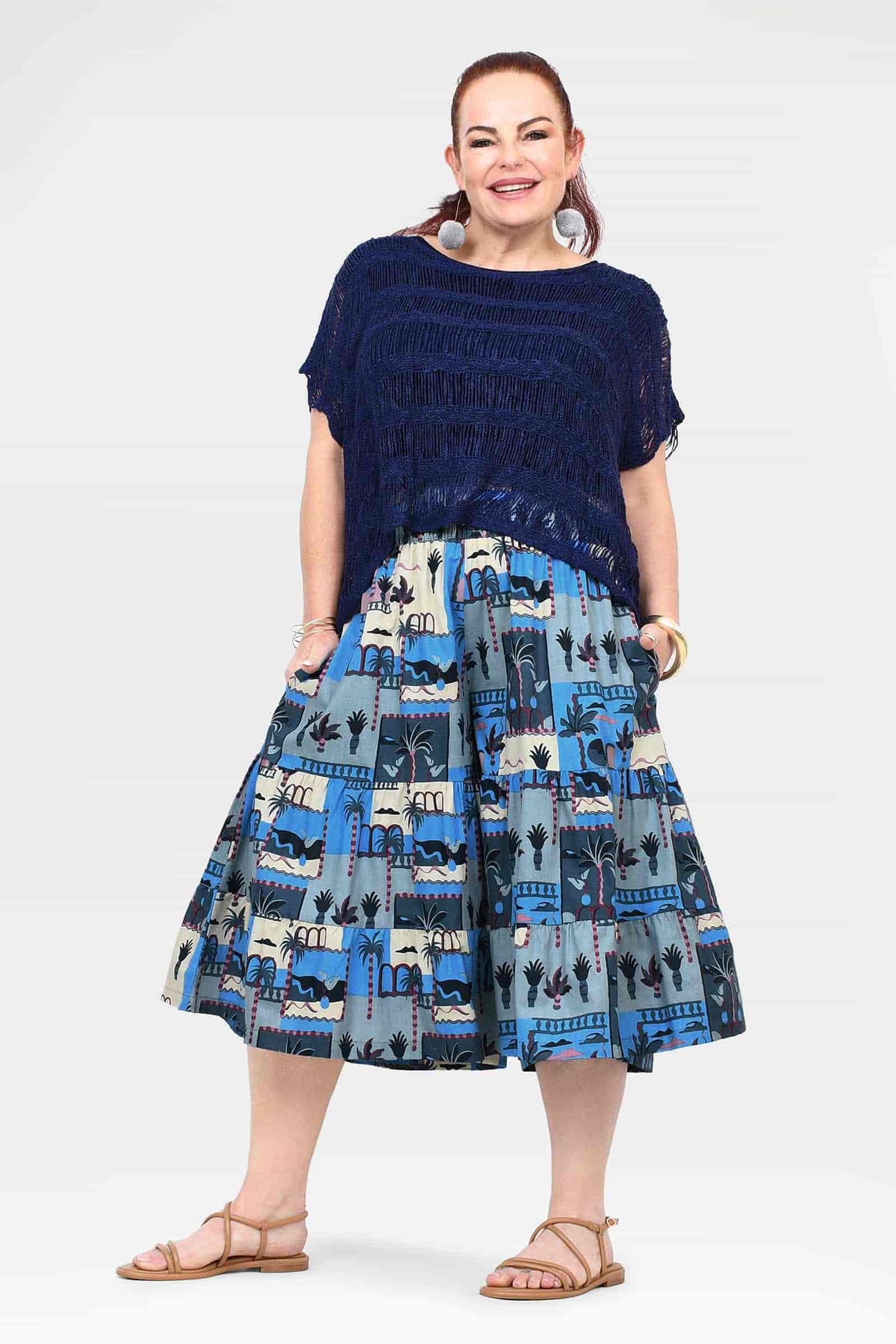Navy and blue printed 3/4 pants with tiered, skirt-like hem and fringe trim