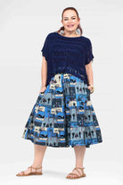 Navy and blue printed 3/4 pants with tiered, skirt-like hem and fringe trim