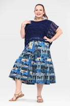3/4 pants in navy with blue, cream, and red printed skirt-like tiers