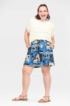 Blue tropical patchwork shorts, above-knee length, elastic waistband and side pockets