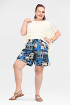 Blue tropical patchwork shorts, slightly gathered elastic waistband, above-knee length