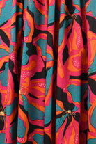 Multicolor floral print fabric for a midi dress, teal, orange, and magenta