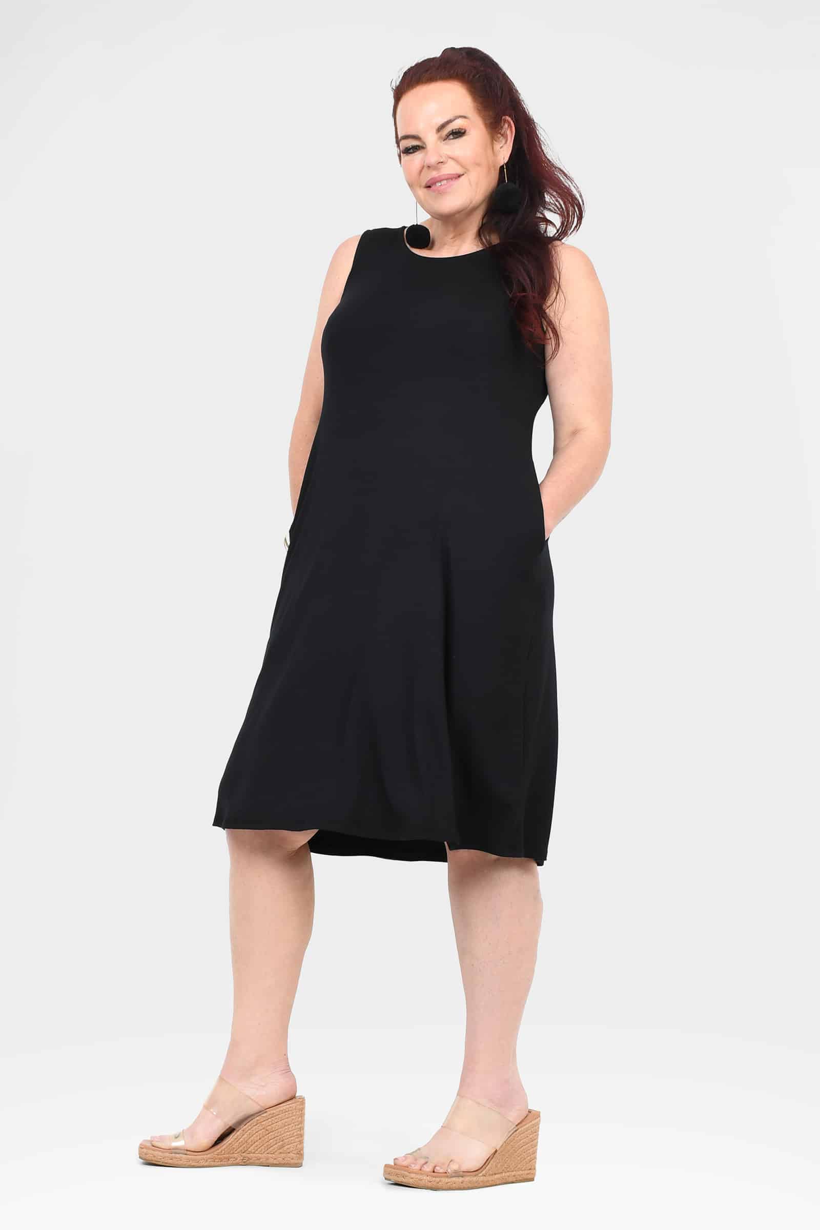 Black sleeveless dress with round neckline and curved A-line hem