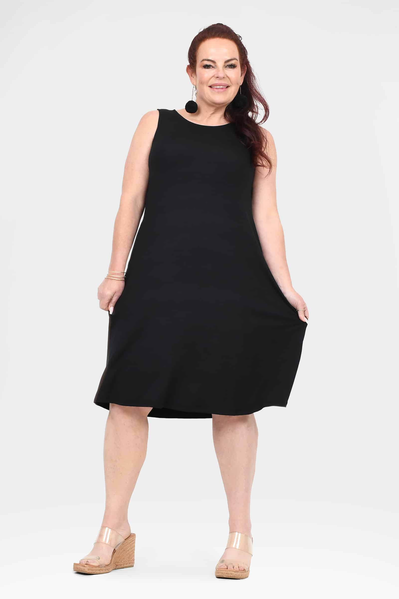 Black sleeveless A-line dress with round neckline and above-knee hem