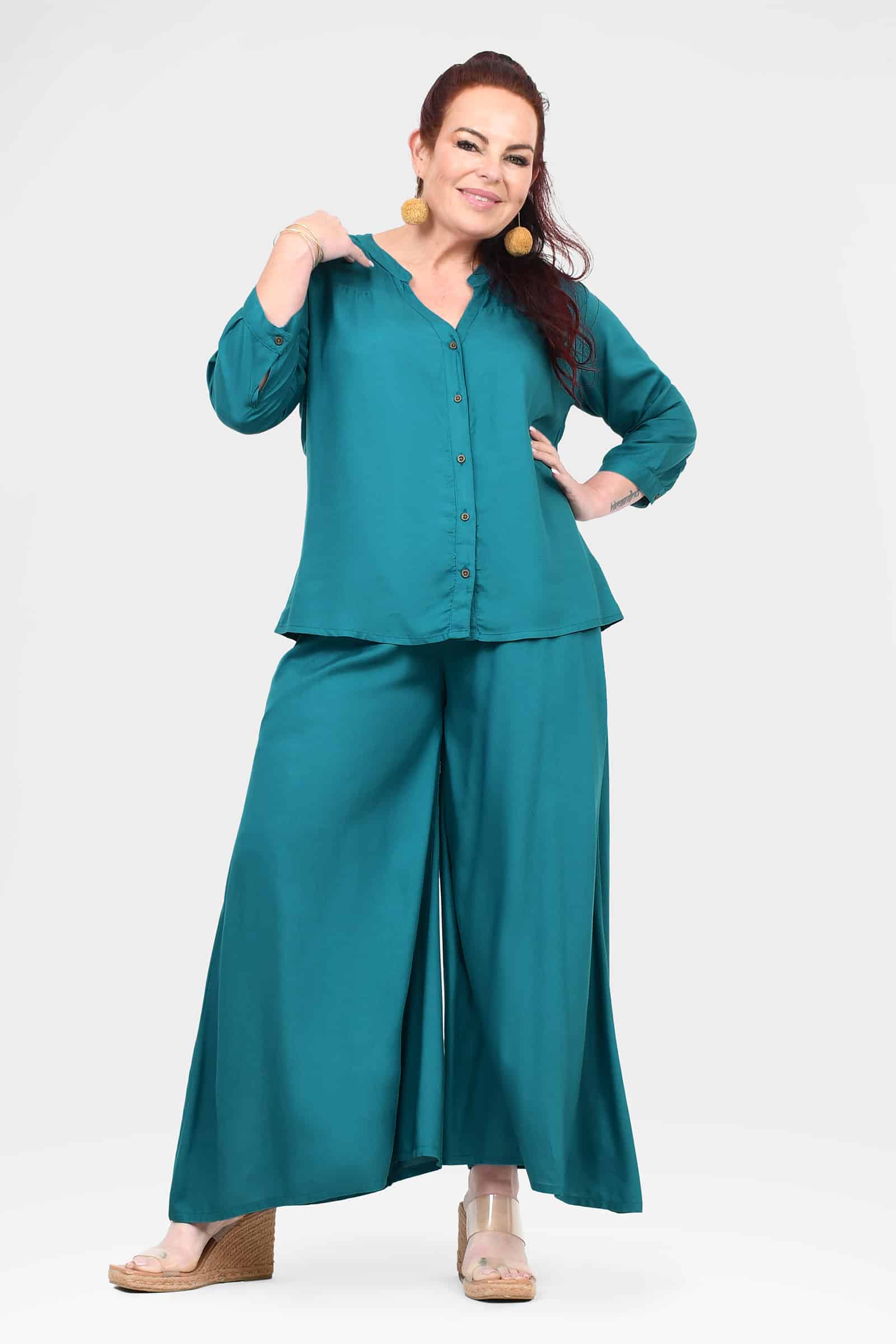 Teal wide-leg pants with full length drape and roomy leg openings