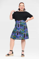 Reversible button skirt, black top with colorful pattern panels, knee length