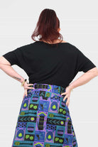 Black short-sleeve top, back view, relaxed drape and wide neckline