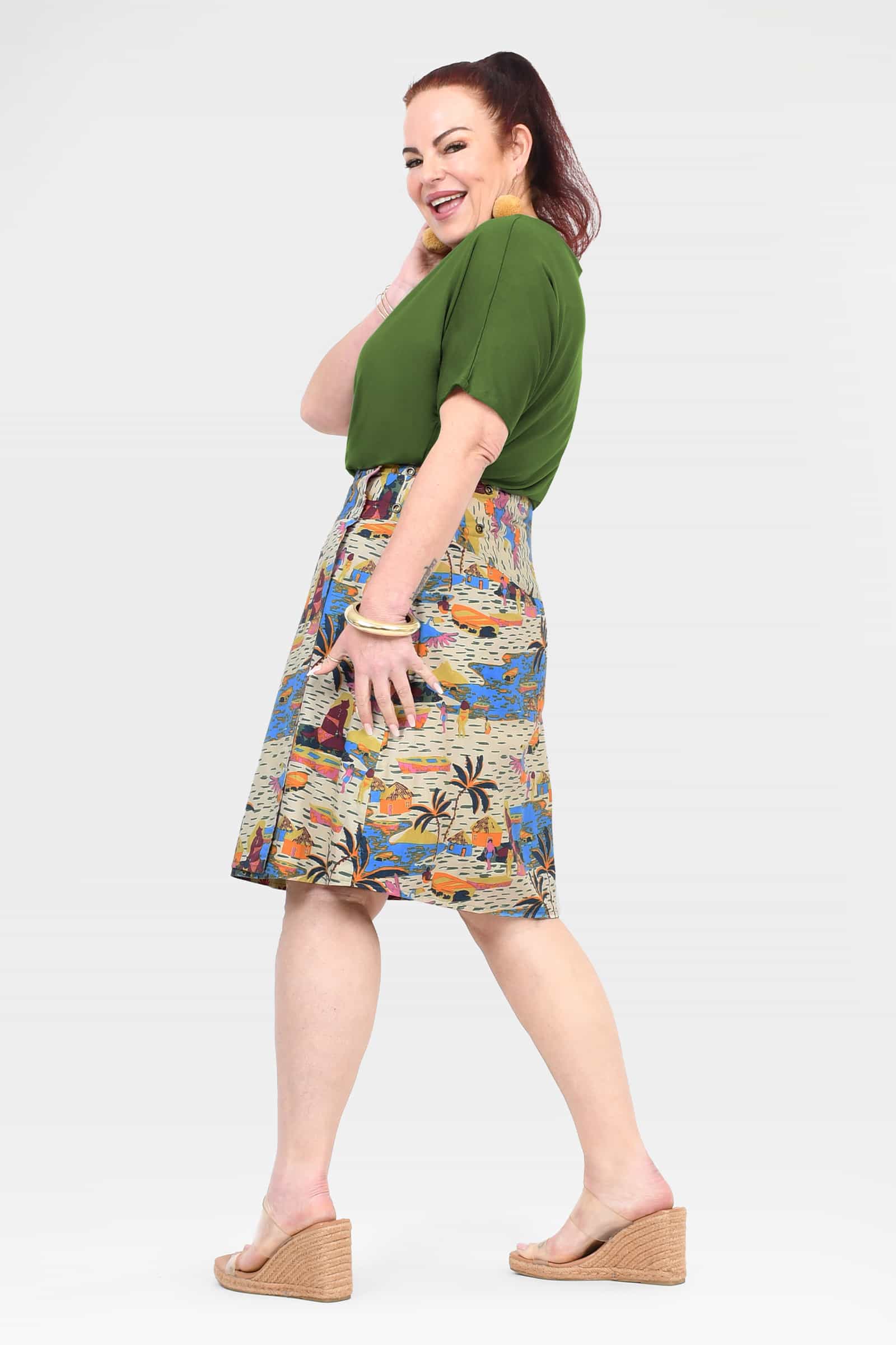 Reversible A-line skirt in cream with colorful tropical scene pattern, side view