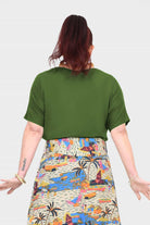 Olive green short-sleeve top from back, draped neckline and relaxed shoulders