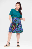 Long button skirt with purple and teal tropical print and center button placket