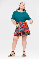 Reversible short graphic skirt in teal, orange, and pink, flared fit