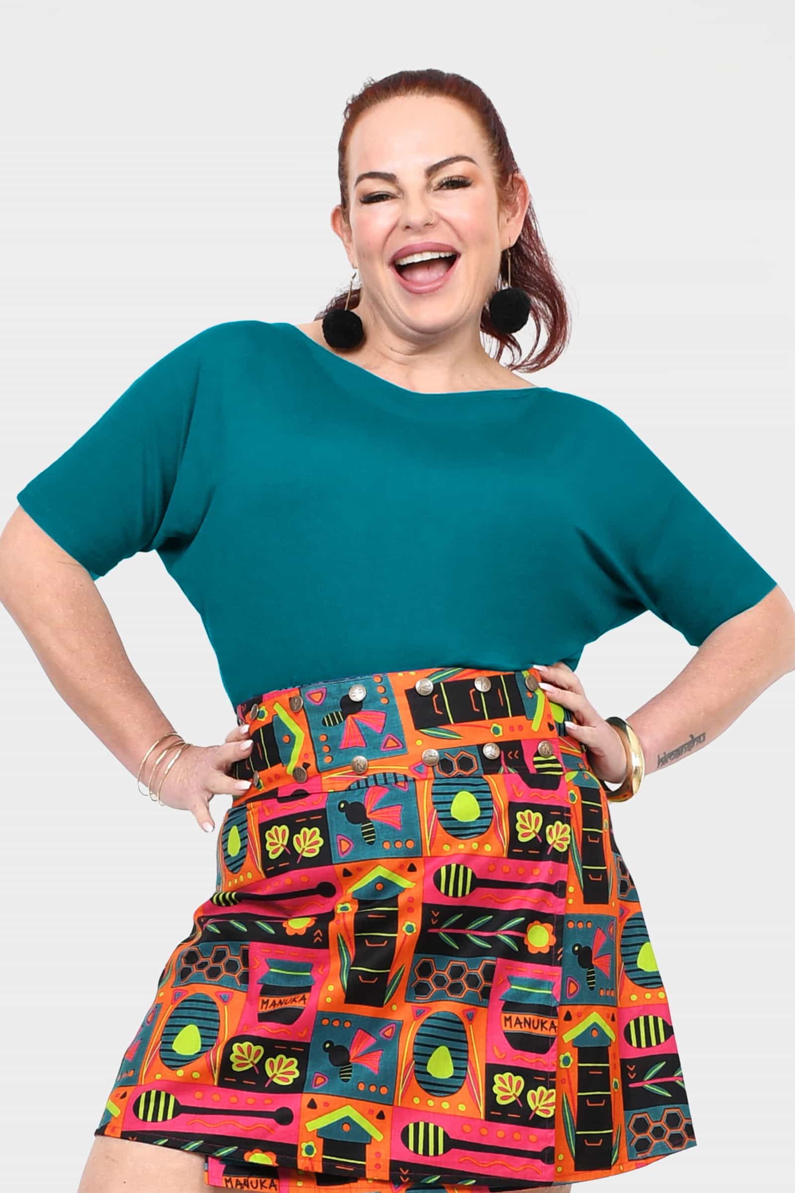 Dark teal short-sleeve top with round neckline and relaxed drape fit