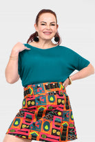 Dark teal short-sleeve jersey top with round neckline, loose easy fit