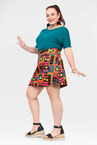 Flared short skirt featuring vivid teal, pink, and orange graphic pattern