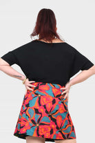 Black short-sleeve top, back view, relaxed drape and wide neckline