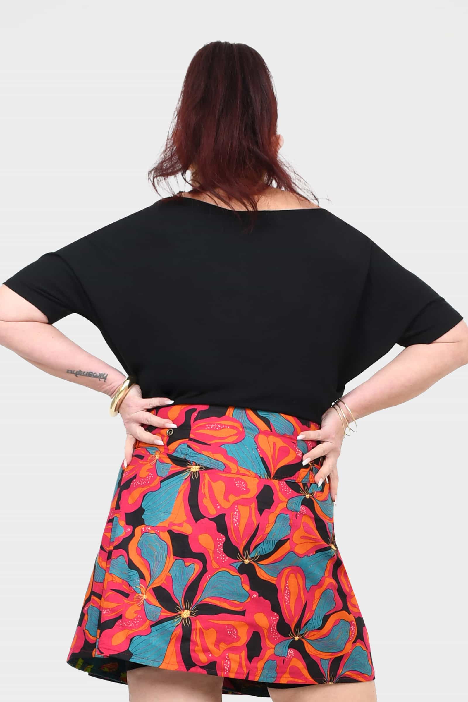 Black short-sleeve top, back view, relaxed drape and wide neckline