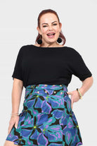 Black short-sleeve top with relaxed fit and wide neckline; smooth solid fabric
