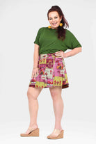 Reversible short button skirt with magenta jungle print panels and gathered hem