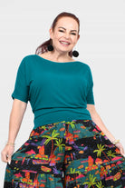 Dark teal short-sleeve top with round neckline and soft, relaxed silhouette
