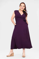 Aubergine sleeveless V-neck dress with waist tie and flared skirt