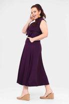 Aubergine sleeveless V-neck dress with waist tie and knee-length flared skirt