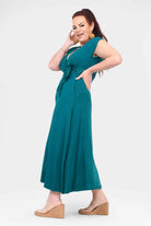 Dark teal sleeveless V-neck midi dress with front tie knot and gathered bodice