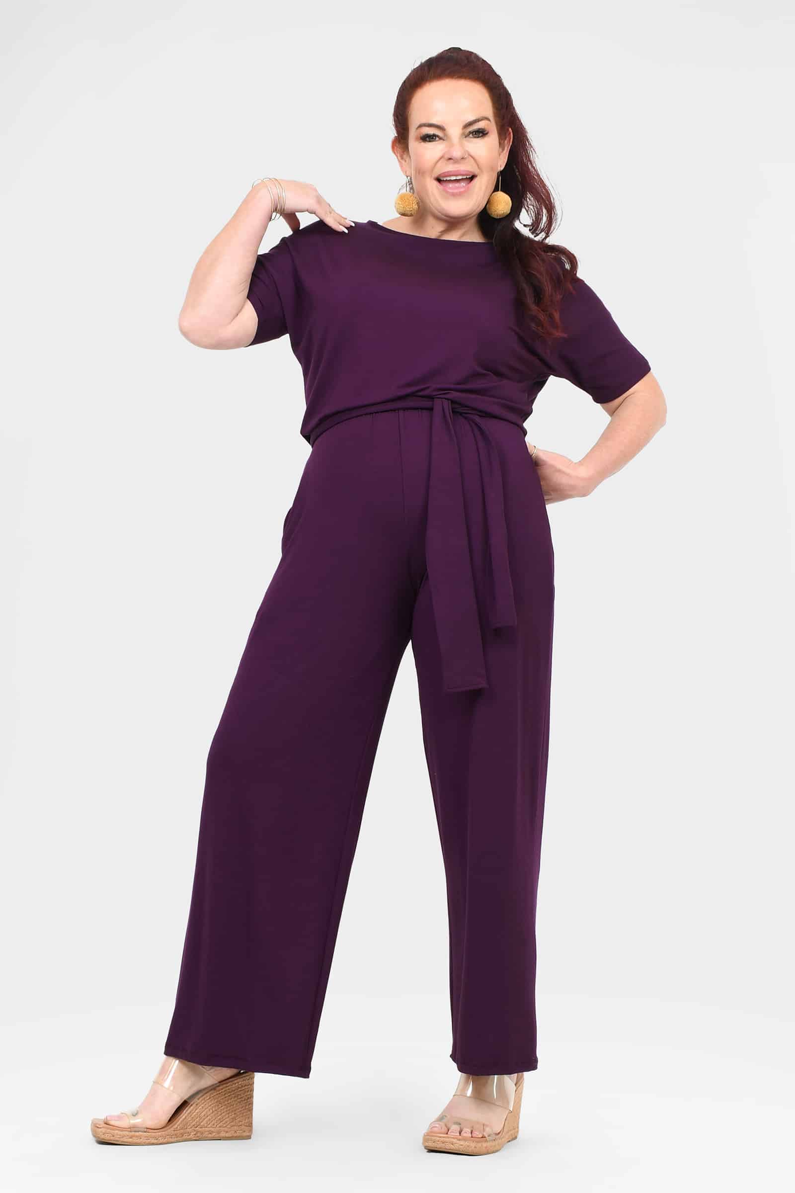 Women's aubergine jumpsuit with short sleeves, tied waist belt, wide-leg pants
