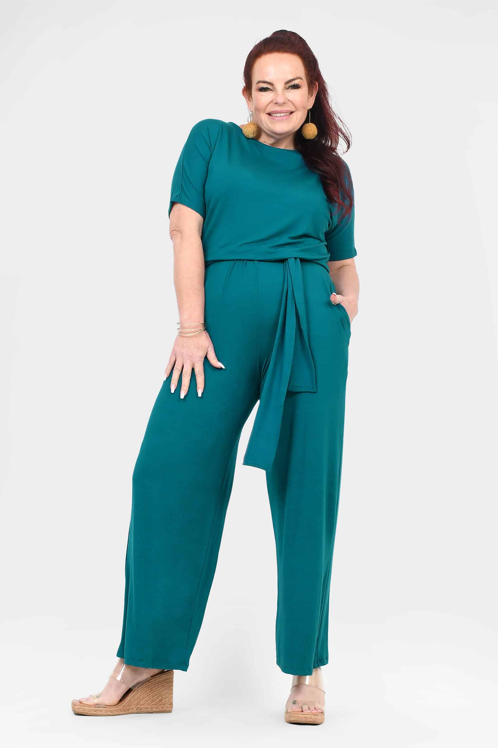 Dark teal tie-waist jumpsuit with short sleeves and wide-leg pants
