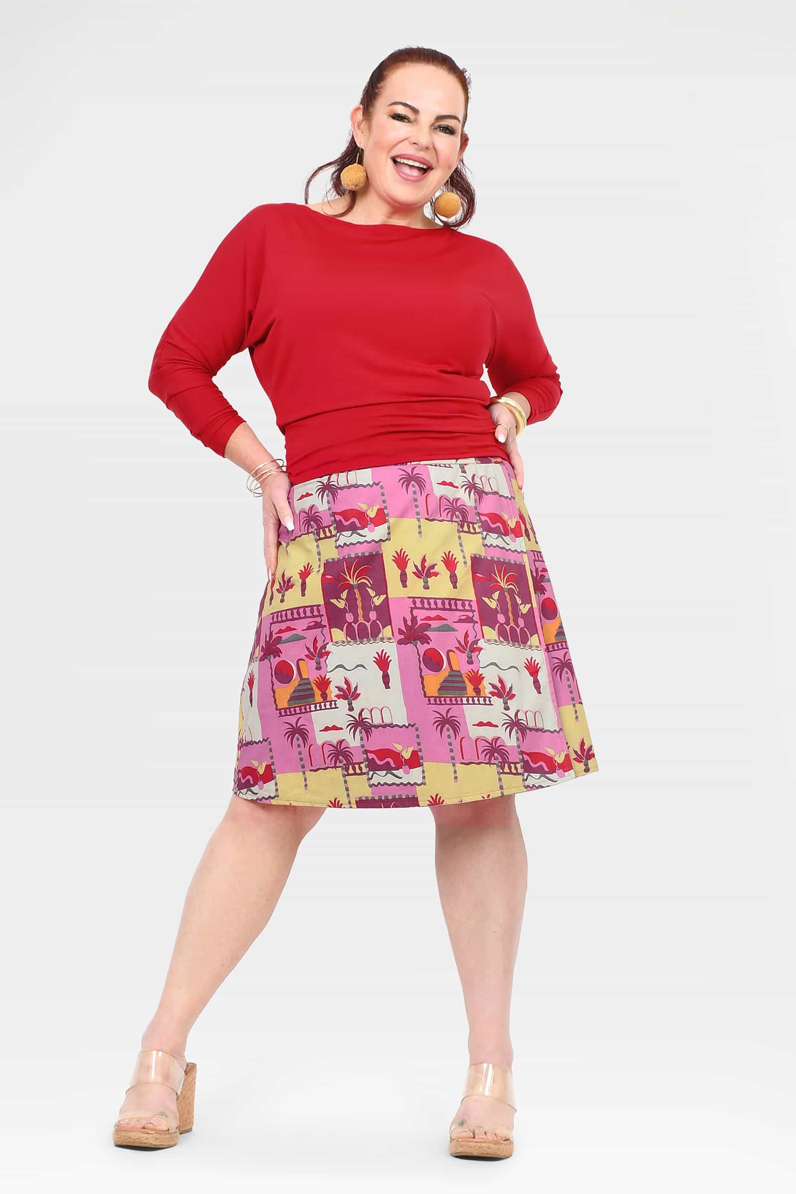 Women's mid-length A-line skirt with pink multicolor print and gathered waist