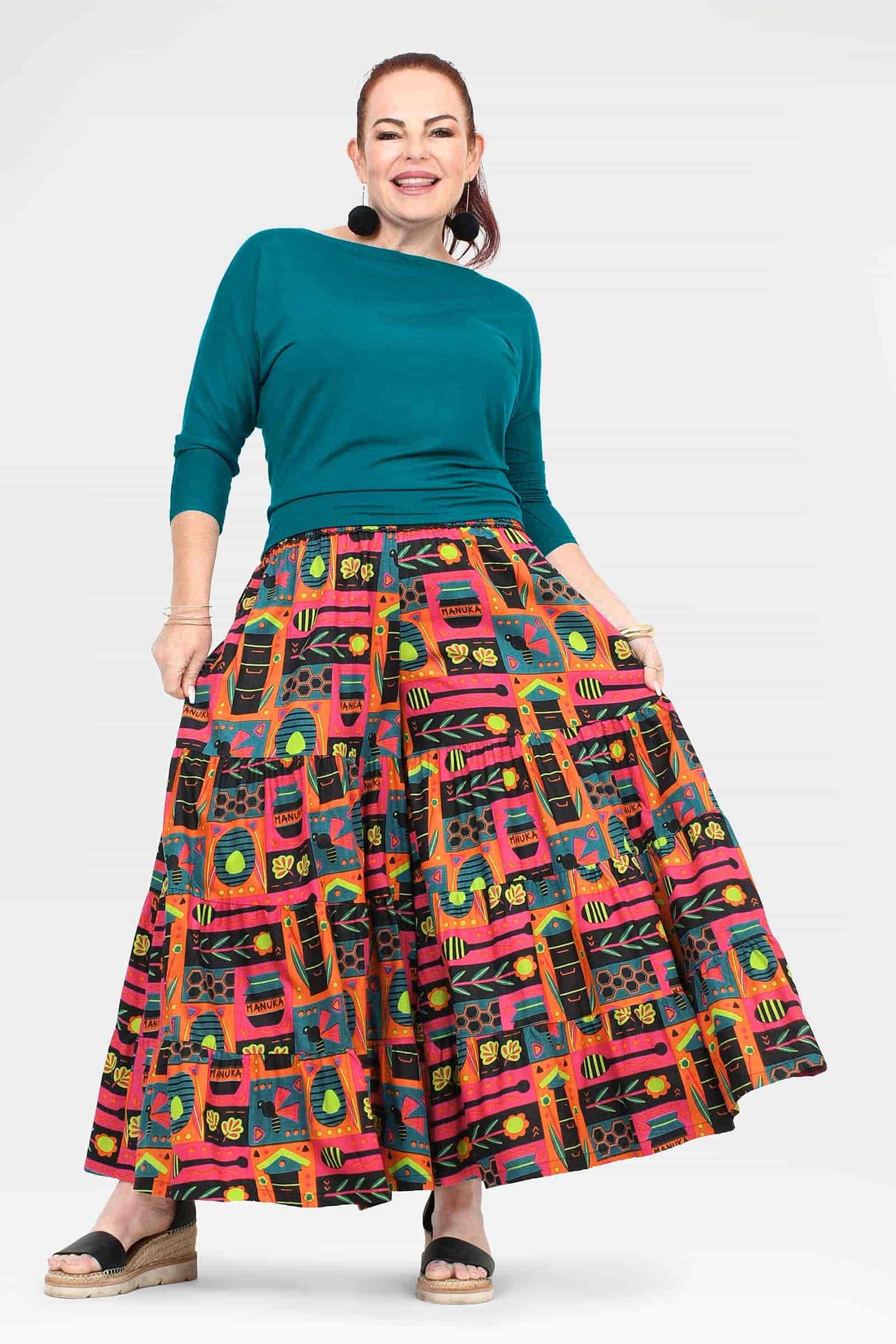 High-waist wide-leg pants with colorful graphic print and teal waistband