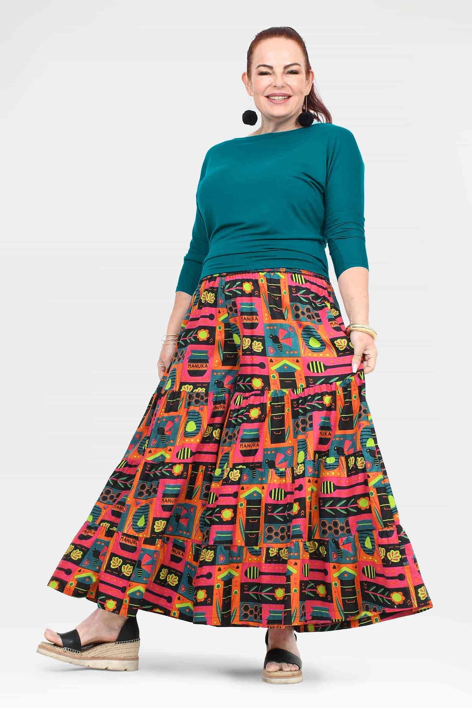 High-waist wide-leg pants with colorful graphic print flare and teal waistband