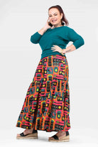 High-waist wide-leg pants with teal waistband and colorful graphic panel print