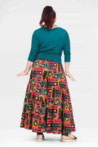 Back view high-waist wide-leg pants with teal waistband and colorful graphic print