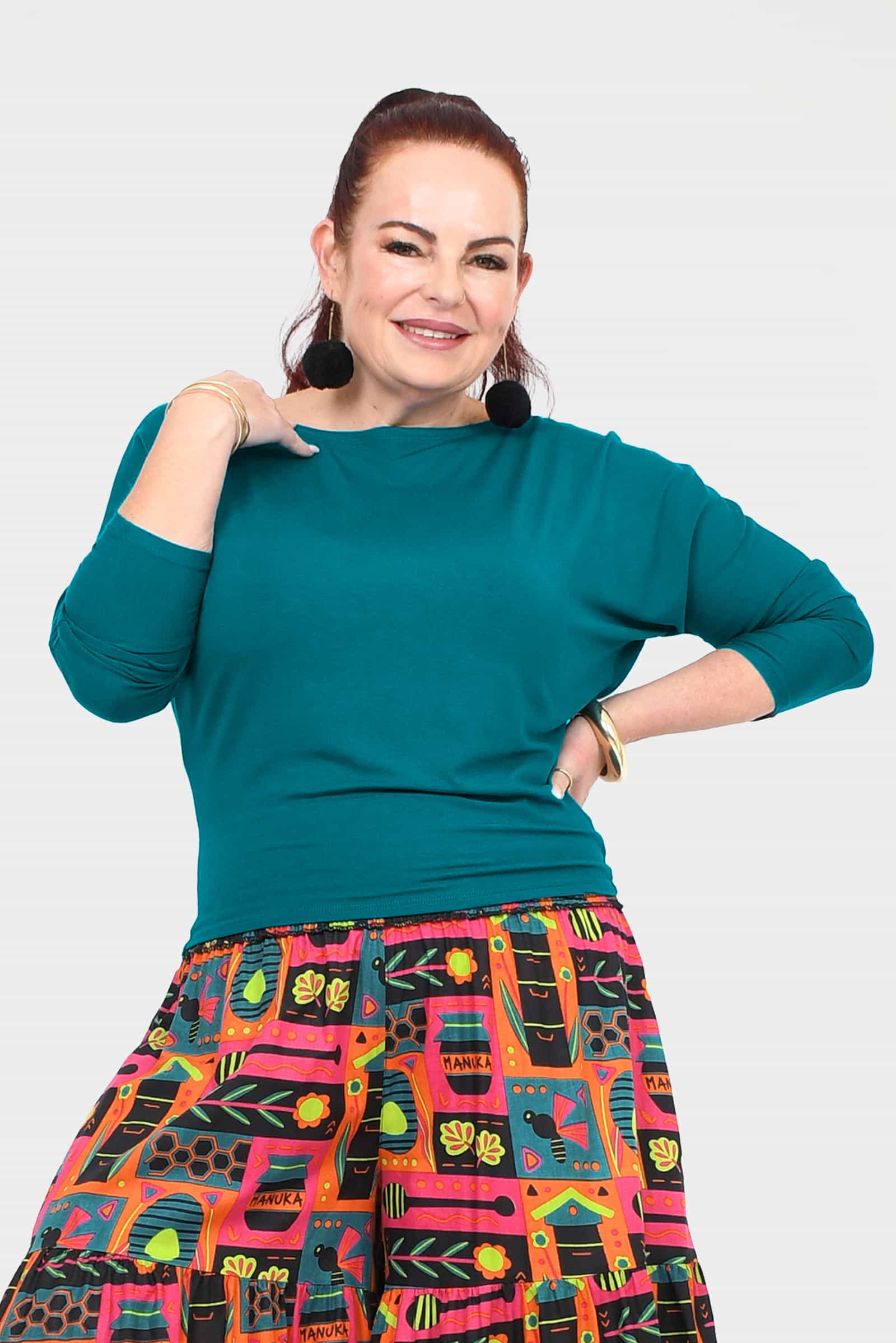 Dark teal crew-neck top with three-quarter sleeves and easy drape